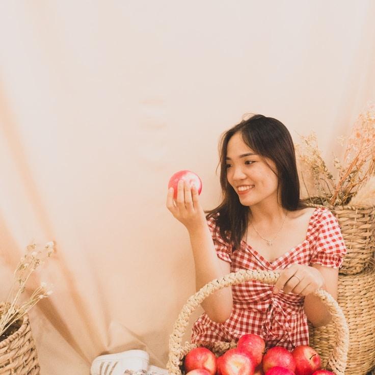 Kaveri Mehta, Lead Design Curator at PlanetSailAmber, reviewing corporate floral arrangements